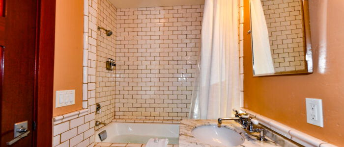Room 2 Bathroom with Tub, Shower Combination. Marble Counter Sink with Vanity Mirror.