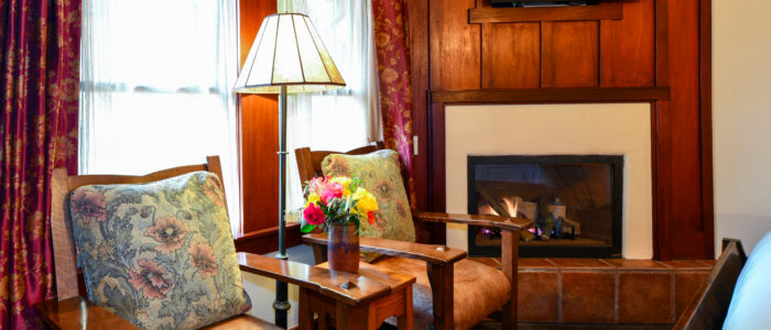 Room 7 Chairs with Table and Floor Lamp In Between, Fireplace, Flat Screen TV