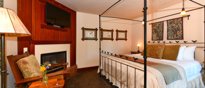 Room 8 King Bed with Fireplace, 2 Chairs and Table